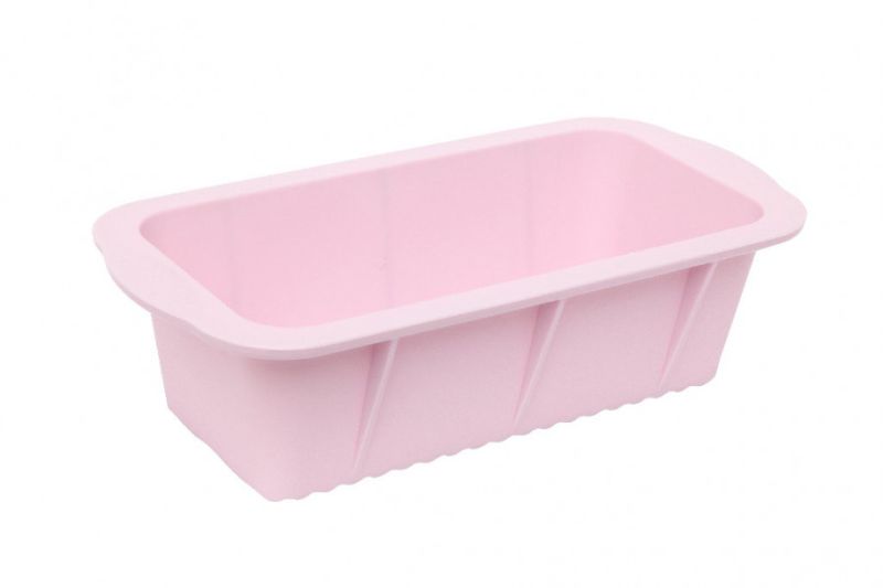 Pale pink Wiltshire Flexible Loaf Pan, non-stick and versatile for baking meat loaf, banana bread, and ginger loaf effortlessly.